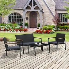 4-piece PE rattan furniture set with 3 upholstered chairs and 1 coffee table